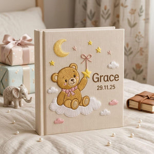 Personalized teddy moon hand embroidered baby photo album with cloud star and celestial nursery design on linen cover