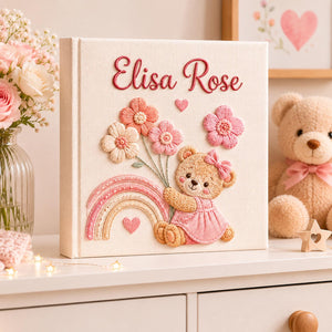 Personalized hand embroidered baby photo album with teddy bear, pastel rainbow, and pink floral embroidery