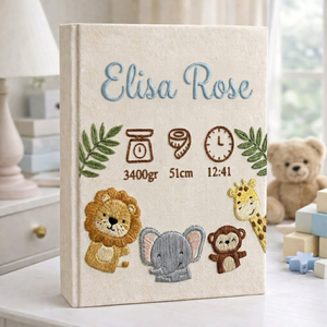 Personalized hand embroidered photo album featuring safari animals and custom birth statistics including weight, length, and birth time