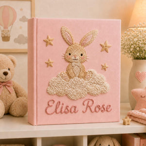 Personalized pink hand embroidered baby photo album with bunny sitting on fluffy clouds and stars