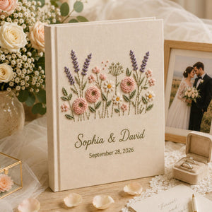 Personalized embroidered wedding photo album with pastel wildflowers, lavender floral embroidery, custom couple names, wedding date, and elegant linen hardcover design