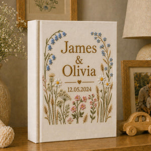 Personalized hand embroidered wildflower wedding photo album with botanical floral design and custom names on linen cover