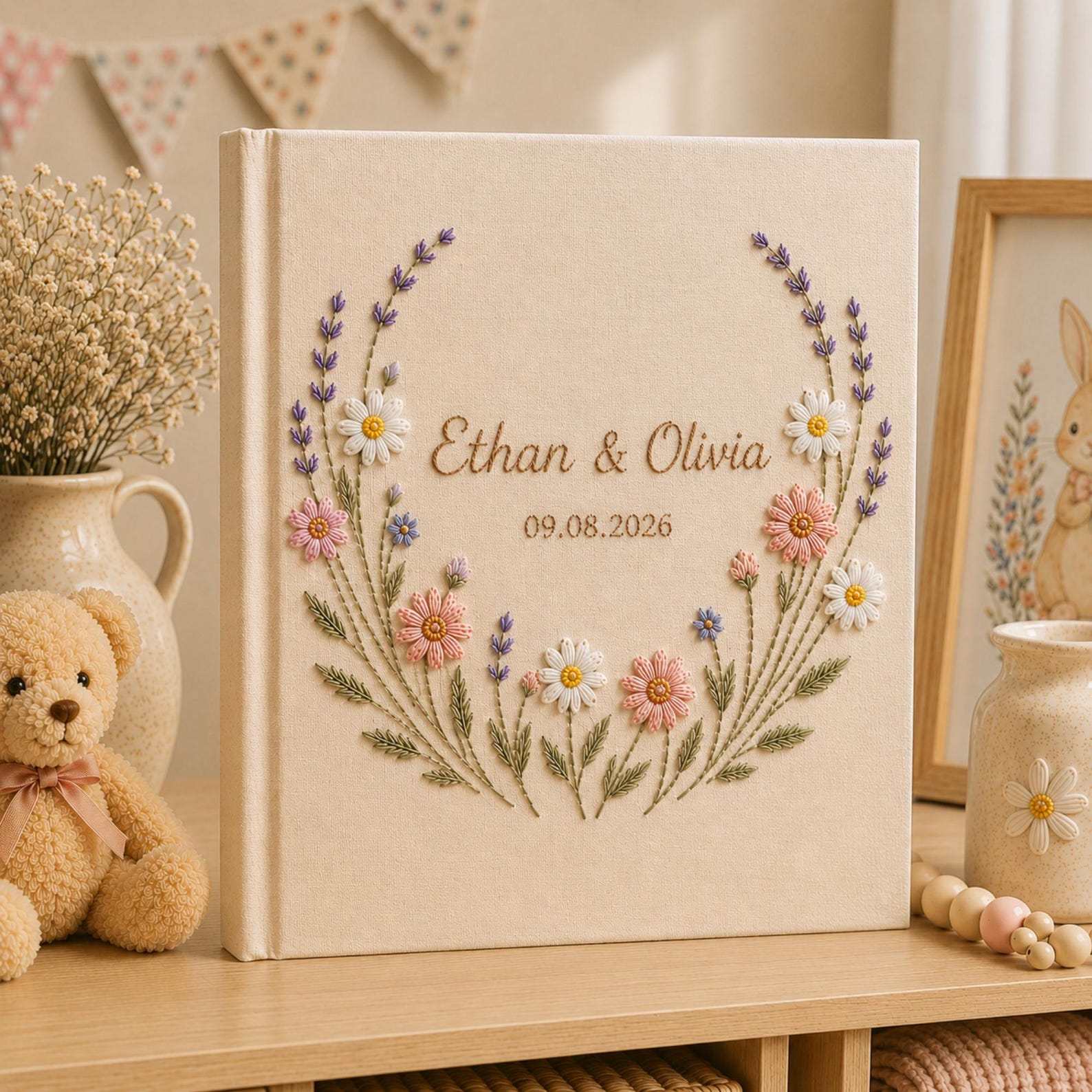 Personalized embroidered wedding photo album with lavender stems pastel daisies and custom couple names on linen cover
