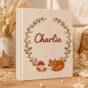Personalized woodland fox hand embroidered photo album with floral wreath and mushroom details for baby keepsake gift