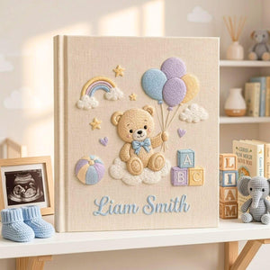 Personalized hand embroidered photo album featuring teddy bear holding pastel balloons with rainbow clouds ABC blocks and custom baby name