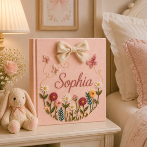 Personalized pink embroidered baby photo album with butterflies and colorful floral garden design