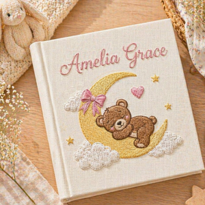 Personalized hand embroidered photo album featuring a sleeping teddy bear resting on a crescent moon with clouds and golden stars