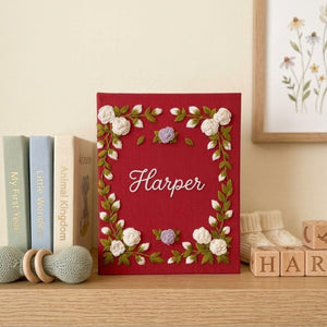 Personalized floral frame hand embroidered baby photo album with embroidered roses and greenery on berry red linen cover