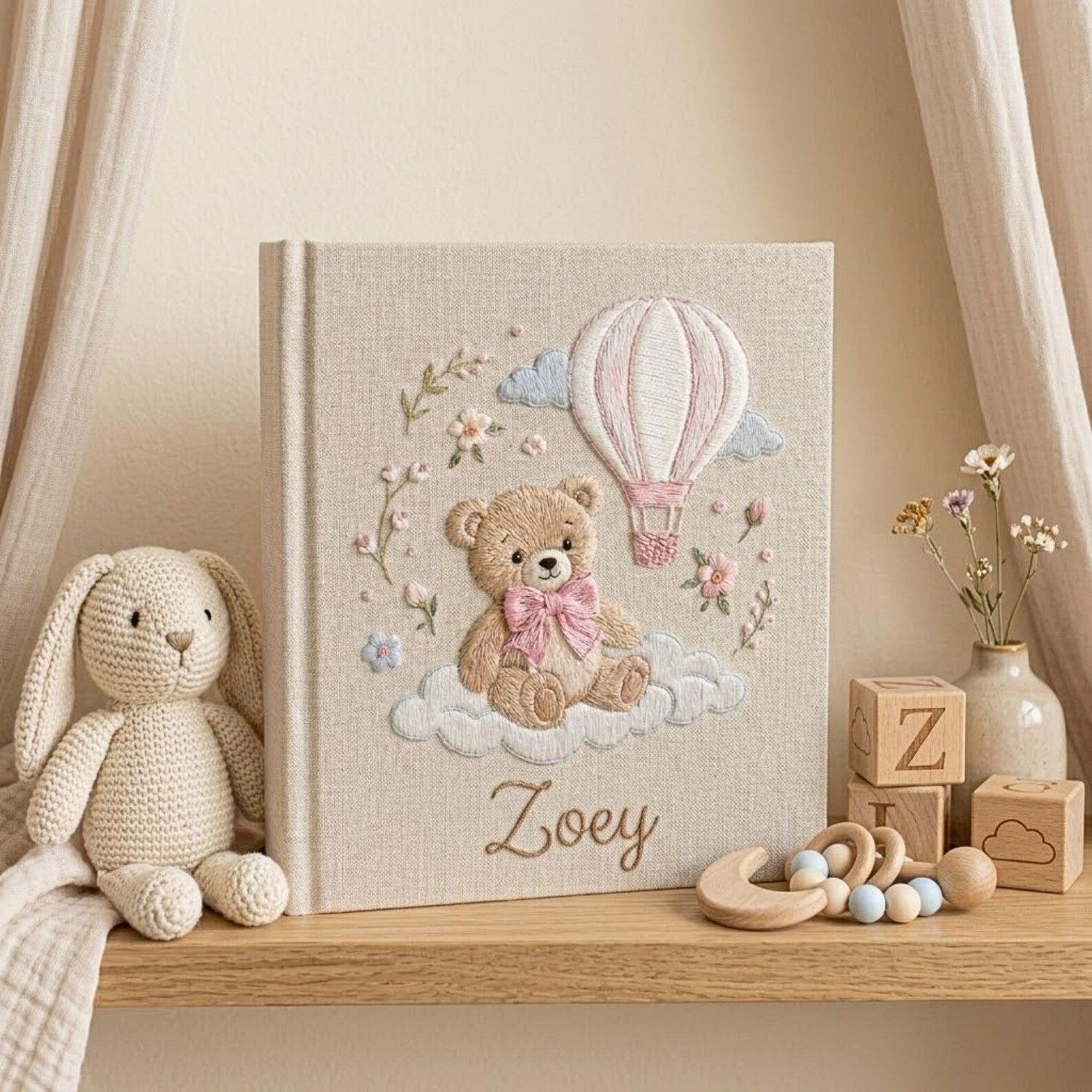 Personalized teddy hot air balloon embroidered baby photo album with pastel nursery design on linen cover