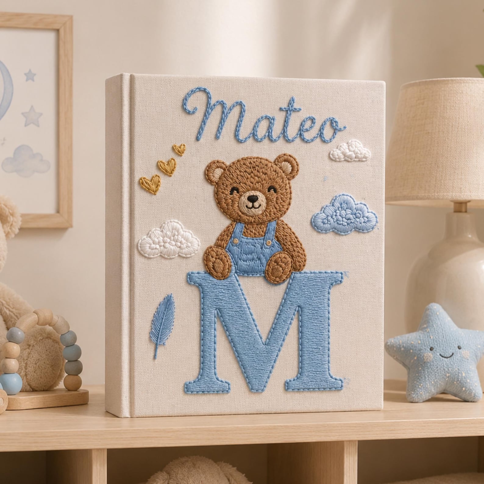 Personalized hand embroidered baby photo album with teddy bear sitting on monogram letter E