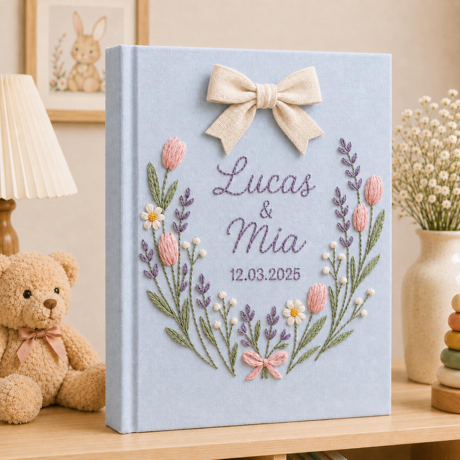 Personalized hand embroidered lavender tulip wedding photo album with decorative bow and custom couple names on linen cover