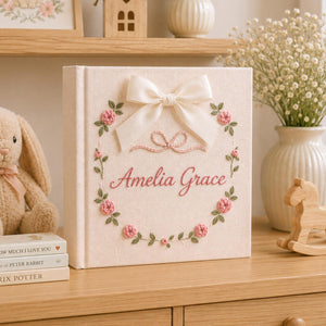 Personalized floral hand embroidered photo album with satin bow and pink rose wreath baby girl keepsake design