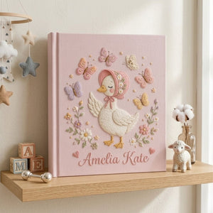 Personalized hand embroidered photo album featuring a cottage style goose wearing a floral bonnet surrounded by butterflies and flowers