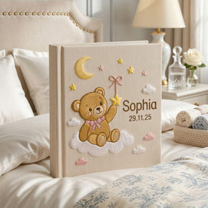 Personalized teddy moon hand embroidered baby photo album with cloud star and celestial nursery design on linen cover
