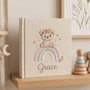 Personalized rainbow teddy bear embroidered baby photo album with pastel rainbow and custom name on linen cover