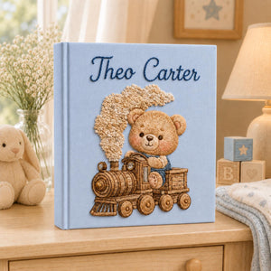 Personalized hand embroidered baby photo album with teddy bear riding a vintage steam train