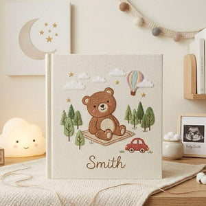 Personalized adventure teddy bear hand embroidered baby photo album with hot air balloon and forest design on linen cover