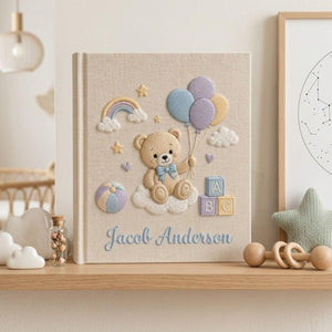 Personalized hand embroidered photo album featuring teddy bear holding pastel balloons with rainbow clouds ABC blocks and custom baby name
