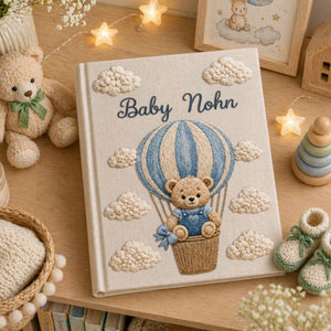 Personalized embroidered baby photo album with teddy bear in blue sky balloon basket and fluffy cloud embroidery