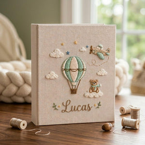 Personalized adventure travel hand embroidered baby photo album with hot air balloon airplane and teddy bear design on linen cover