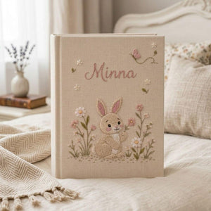 Personalized floral bunny hand embroidered baby photo album with pastel flowers and butterfly design on linen cover
