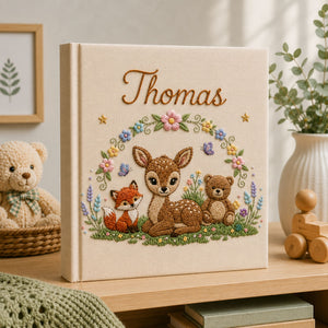 Personalized hand embroidered photo album featuring a woodland fawn fox and teddy bear surrounded by flowers and butterflies on a premium linen cover customized with a baby name