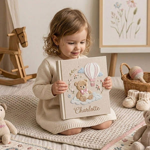 Personalized teddy hot air balloon embroidered baby photo album with pastel nursery design on linen cover
