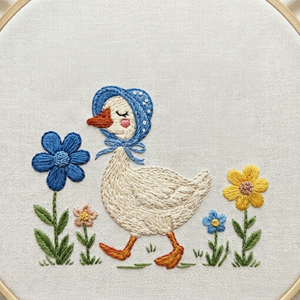 Personalized hand embroidered photo album featuring a bonnet goose walking through a whimsical storybook flower garden