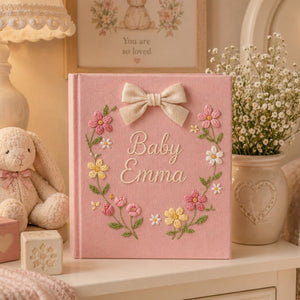 Personalized hand embroidered baby photo album with pastel floral wreath embroidery and elegant linen bow detail