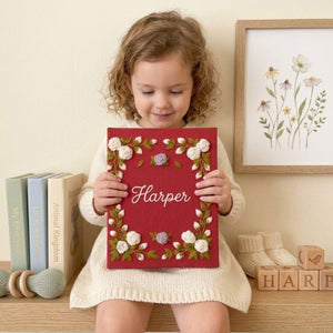Personalized floral frame hand embroidered baby photo album with embroidered roses and greenery on berry red linen cover