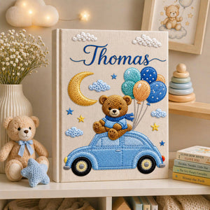 Personalized hand embroidered baby photo album featuring teddy bear on vintage blue car with balloons, moon, stars, and custom name embroidery