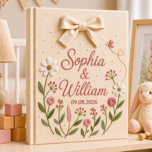 Personalized hand embroidered floral wedding photo album with bow detail and custom couple names on linen cover