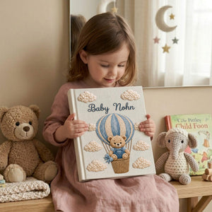 Personalized embroidered baby photo album with teddy bear in blue sky balloon basket and fluffy cloud embroidery