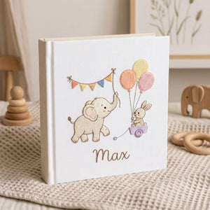 Personalized embroidered baby photo album with elephant, bunny, pastel balloons, and custom name embroidery