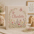 Personalized hand embroidered photo album featuring pastel wildflowers butterflies and custom name embroidery on linen cover