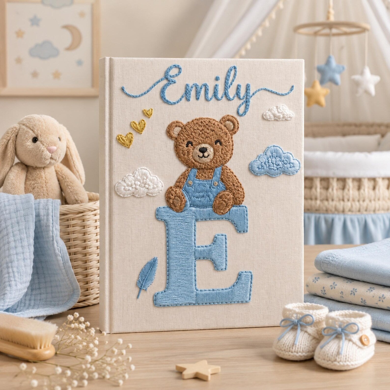 Personalized hand embroidered baby photo album with teddy bear sitting on monogram letter E