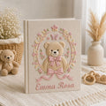Personalized hand embroidered photo album featuring a vintage teddy bear surrounded by a floral wreath, pink bows and delicate butterfly accents