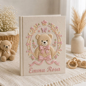 Personalized hand embroidered photo album featuring a vintage teddy bear surrounded by a floral wreath, pink bows and delicate butterfly accents