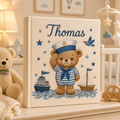 Personalized hand embroidered photo album featuring a sailor teddy bear captain with ships, sailboat, stars and ocean waves on a linen cover