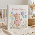 Personalized hand embroidered photo album featuring a birthday teddy bear holding pastel balloons in a blooming flower garden