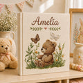 Personalized embroidered baby photo album with woodland teddy bear, butterflies, and greenery design