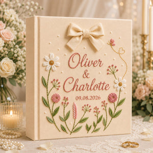 Personalized hand embroidered floral wedding photo album with bow detail and custom couple names on linen cover