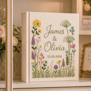 Personalized hand embroidered wild meadow wedding photo album with colorful botanical flowers and custom names on linen cover