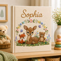 Personalized hand embroidered photo album featuring a woodland fawn fox and teddy bear surrounded by flowers and butterflies on a premium linen cover customized with a baby name