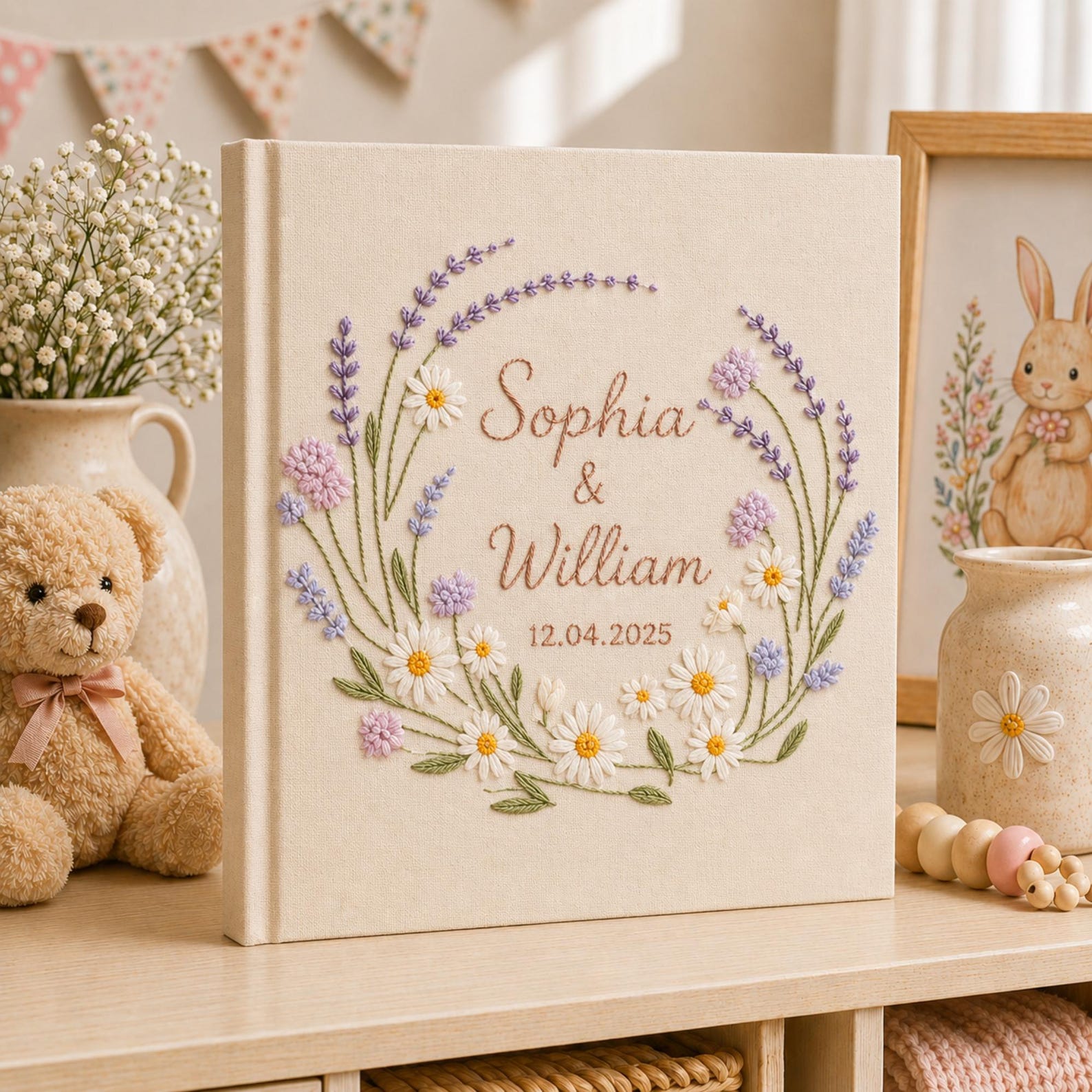 Custom lavender floral embroidered wedding photo albums with pastel botanical wreaths, daisy flowers, and personalized couple names on linen covers
