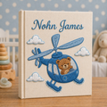 Personalized hand embroidered photo album featuring an aviator teddy bear flying a vintage airplane through fluffy clouds with custom name embroidery