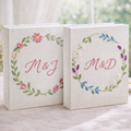 Personalized floral wreath hand embroidered photo album with custom initials on linen cover