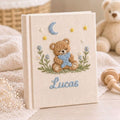 Personalized sleepy teddy hand embroidered baby photo album with moon star and bedtime nursery design on linen cover