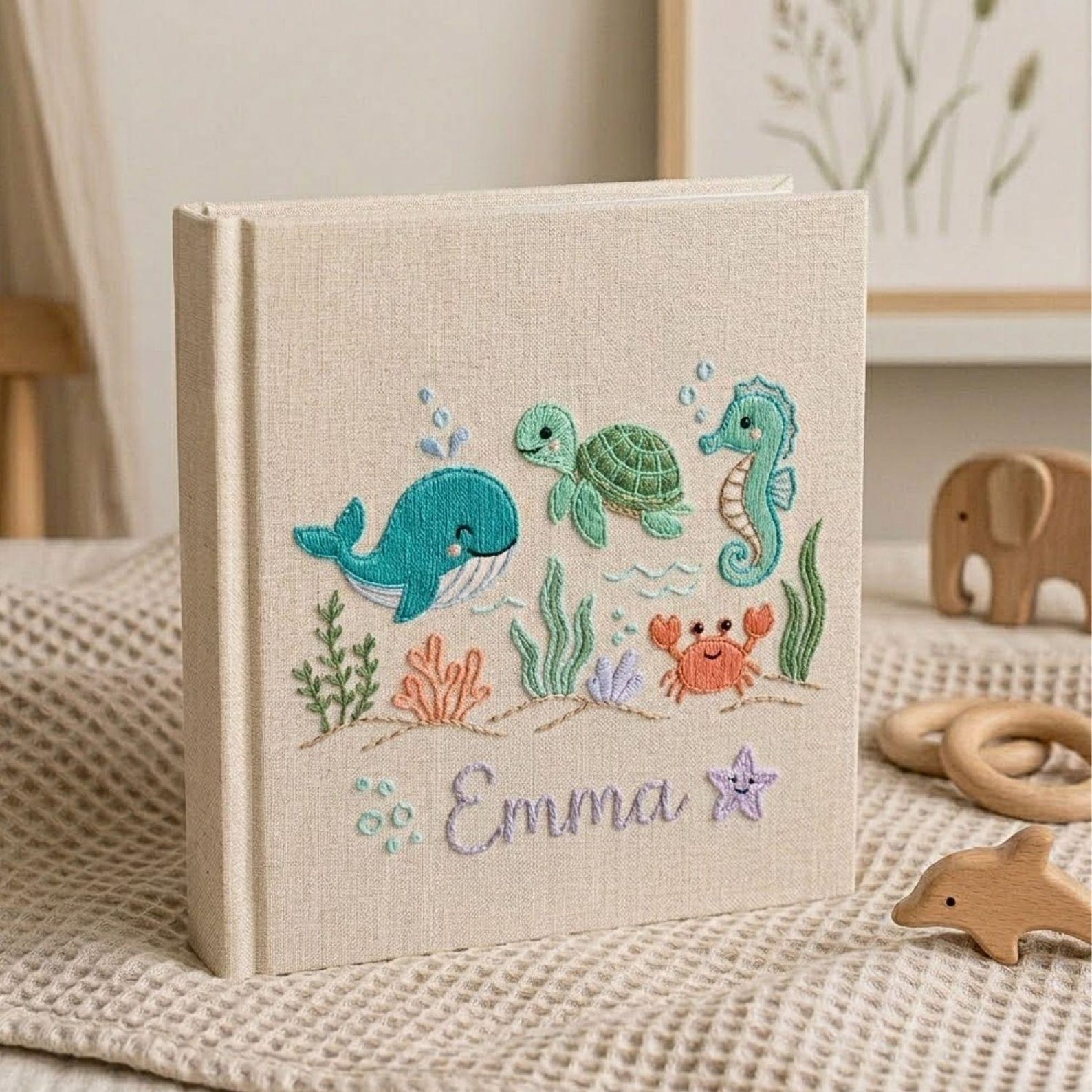 Personalized embroidered baby photo album with whale, turtle, seahorse, crab, ocean plants, and custom name embroidery