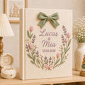 Personalized hand embroidered lavender tulip wedding photo album with decorative bow and custom couple names on linen cover